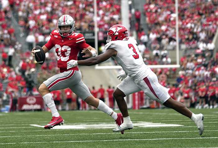 Ohio State Buckeyes quarterback Devin Brown (33) is sacked by Youngstown State Penguins linebacker Alex Howard (3) during their NCAA football game at Ohio Stadium